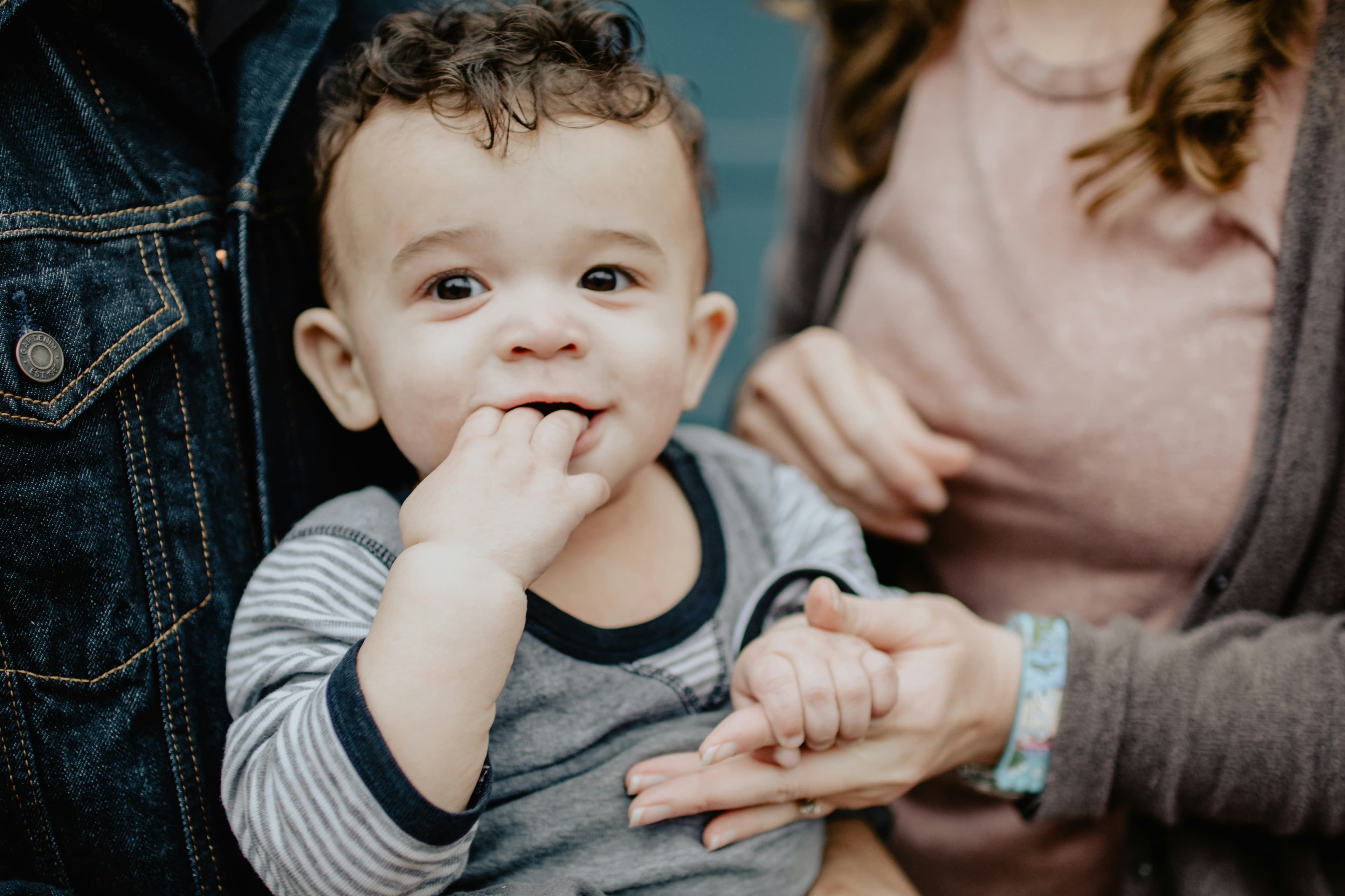 Parent playing with an infant during tummy time
